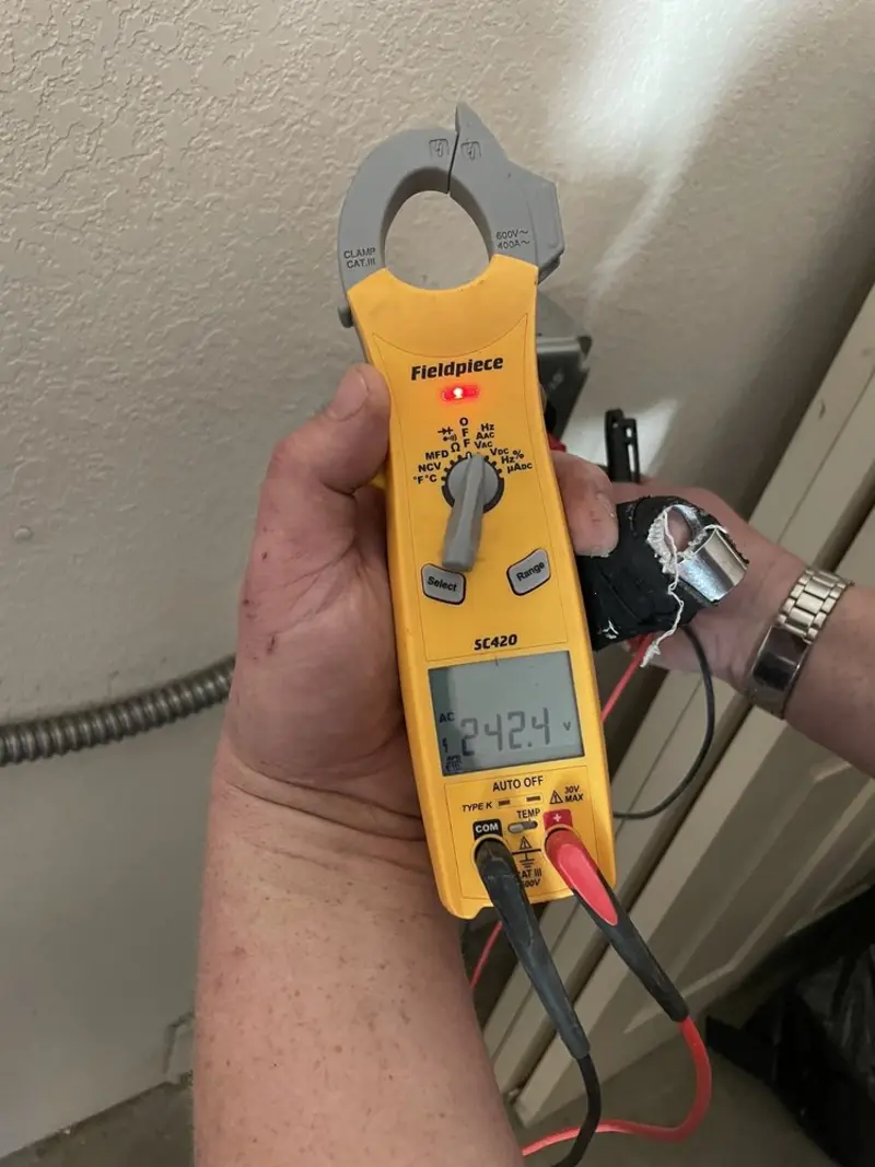 Voltage testing with clamp meter during Whole House Surge Protector in La Salle